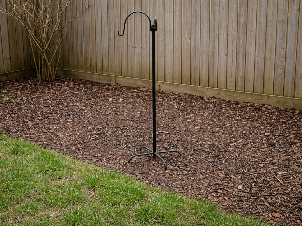 Bird feeder removed from a residential garden, area tidied during nesting season.